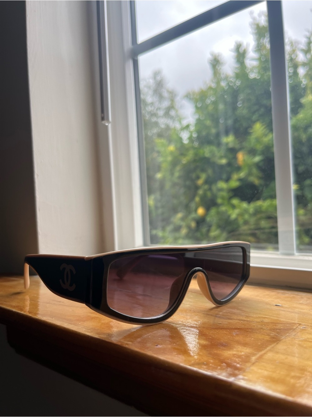 CHANEL Black Shield Sunglasses with Purple Gradient Lenses